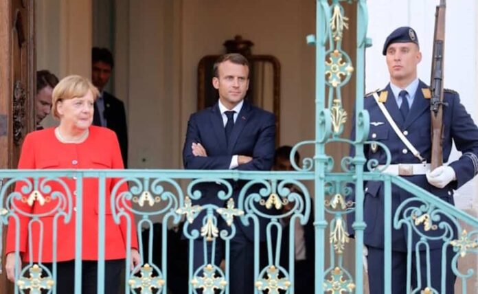Conversation merkel macron Angela Merkel et Emmanuel Macron à Mesberg (Allemagne), le 19 juin 2018. Ludovic Marin/AFP