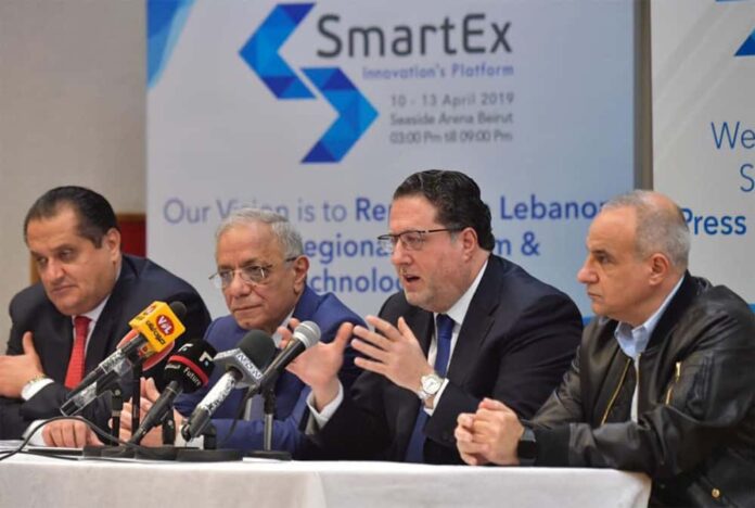 SmartEx Mohamed Choucair Le Ministre des Télécoms, Mohamed Choucair, s'exprimant au sujet de l'installation d'un réseau de fibres optiques au Liban lors de la conférence SmartEX. Origine photo: Twitter