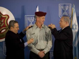 Israeli Prime Minister Benjamin Netanyahu, right, and Defense Minister Ehud Barak, left, take part in a ceremony formally promoting Maj. Gen. Benny Gantz, center, to lieutenant general and making him the 20th chief of the general staff of the Israel Defense Forces Feb. 14, 2011, at the prime minister's office in Jerusalem. U.S. Chairman of the Joint Chiefs of Staff Navy Adm. Mike Mullen was among the guests in attendance. (U.S. Army photo by Staff Sgt. Teddy Wade/Released)
