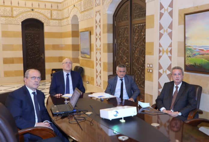 Prime Minister Najib Mikati with Minister of Finance Youssef Khalil and Governor of Banque du Liban Riad Salamé. Photo credit: Dalati and Nohra