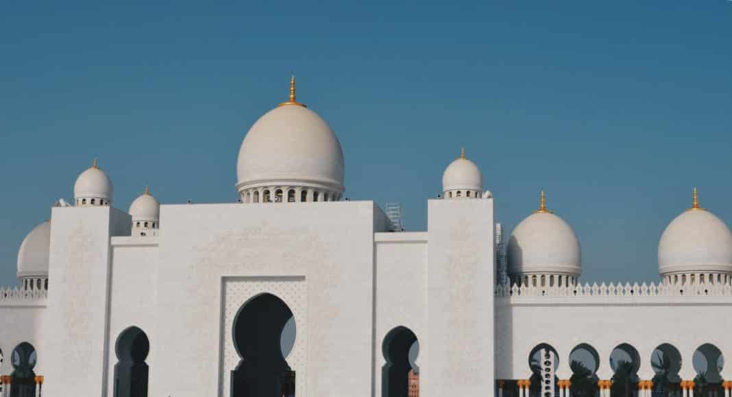 view of mosque in city against clear sky