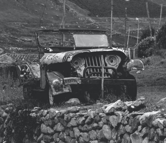 black and white road people dust