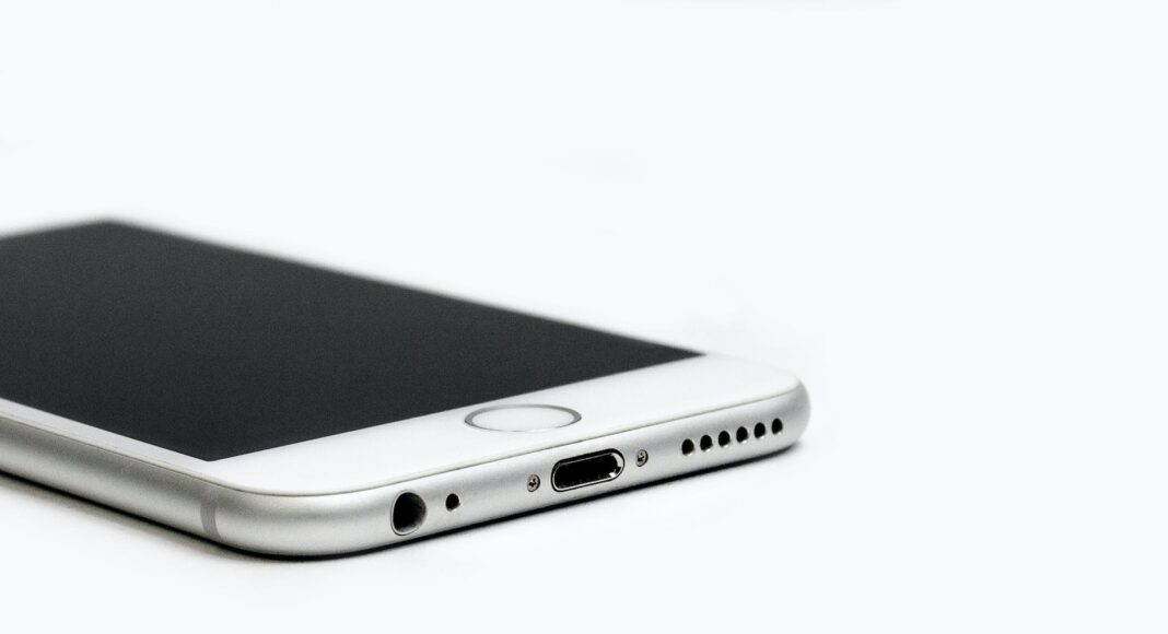 close up of mobile phone against white background