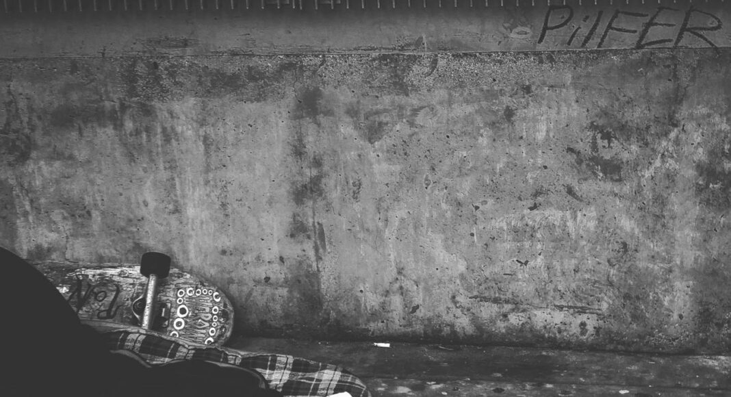 person wearing high top sneakers