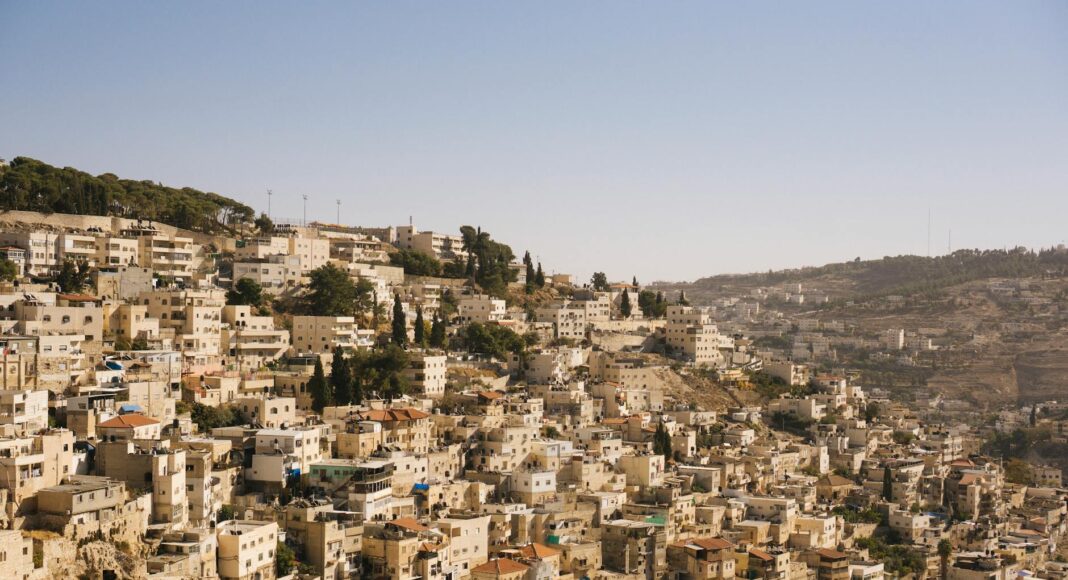 beige concrete buildings on high ground