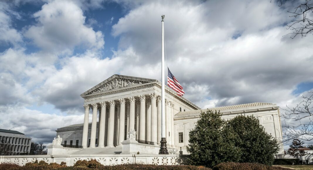 a large building with a flag on top of it
