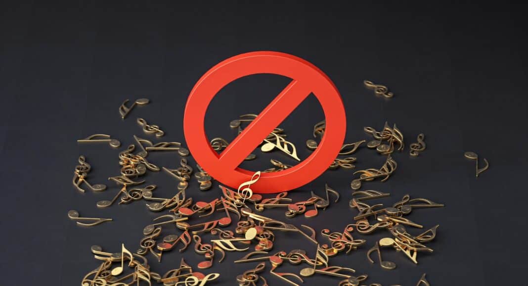 a pile of musical notes and a red sign