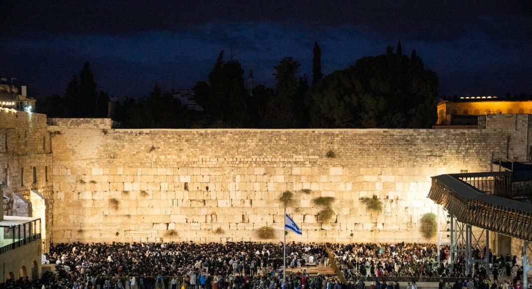 people gathered near pole