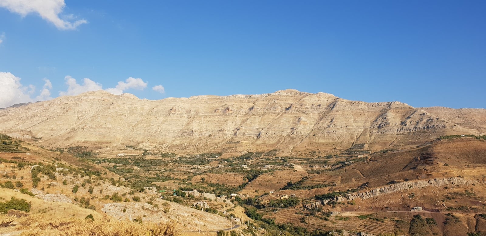 brown rocky mountain under blue sky during daytime