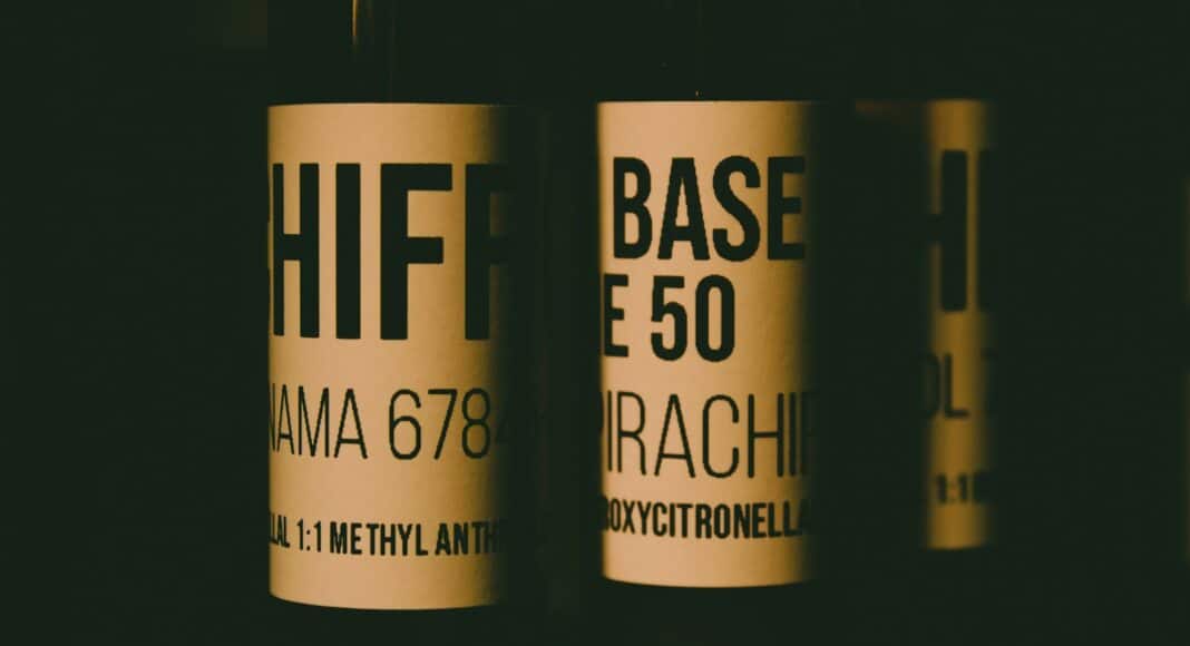 a close up of three bottles of wine