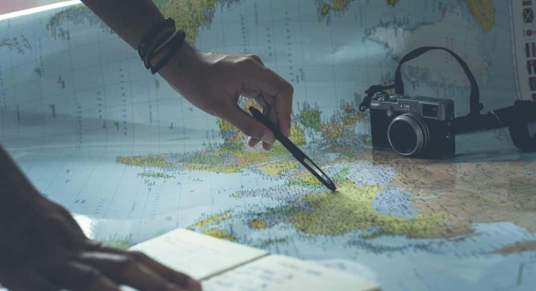 person writing on white paper