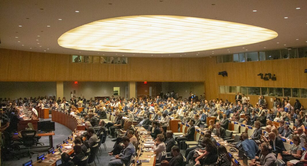 people sitting on chairs inside building