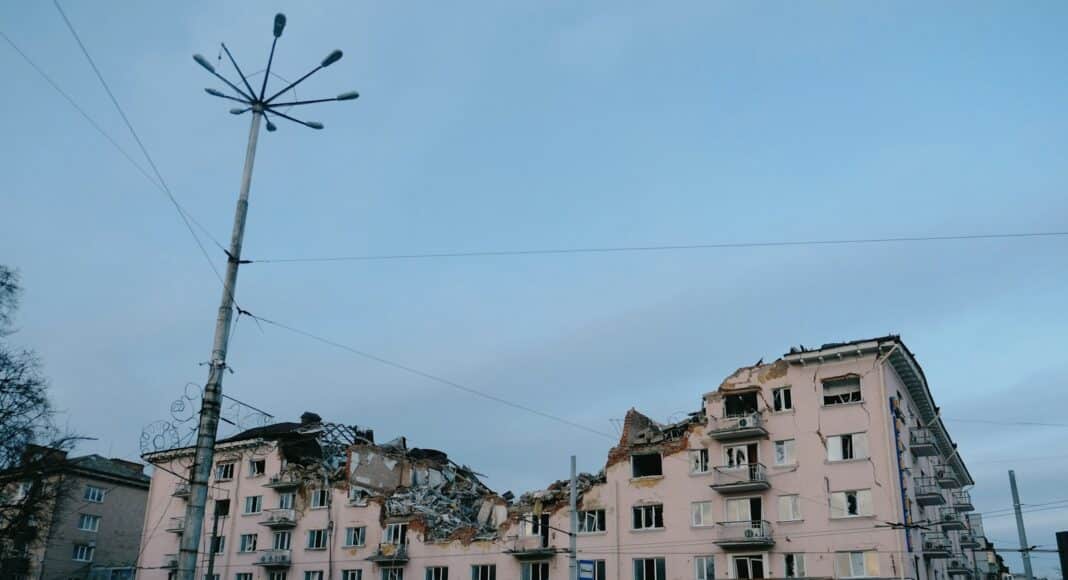 a building that has been torn down and is next to a street light