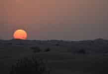 snow covered mountain during sunset