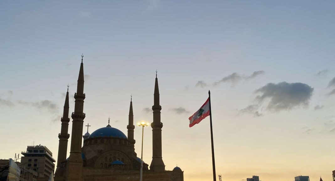 a large building with a flag flying in front of it