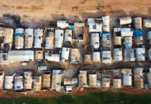 An aerial view of a lot of parked cars